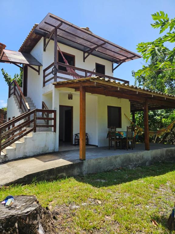 a view of a house with a pergola at Ap Aconchego Carapitangui in Barra Grande