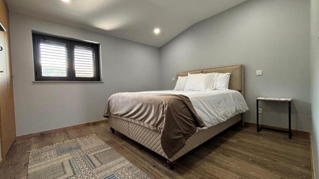 Postel nebo postele na pokoji v ubytování As Casas do Penedo da Moura