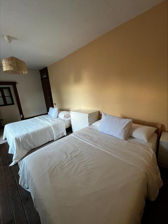 Ένα ή περισσότερα κρεβάτια σε δωμάτιο στο Miquinhas Norte