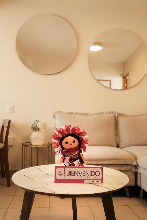 a table in a living room with a sign on it at Providencia Amealco in Amealco
