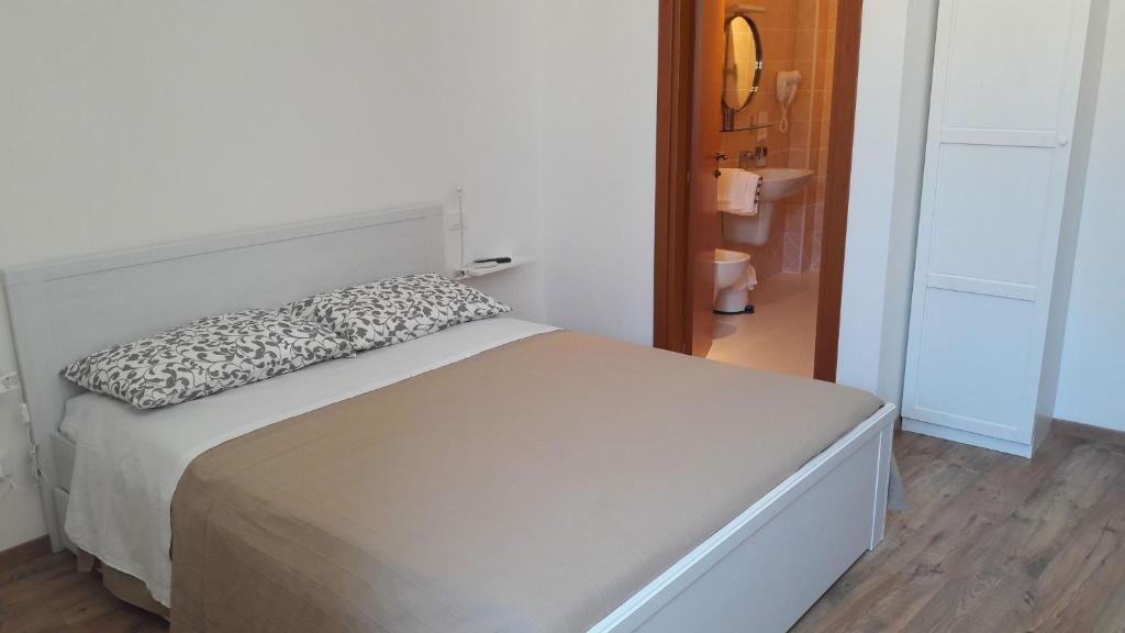 Postel nebo postele na pokoji v ubytování Camere Calocci