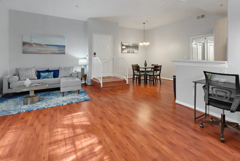 a living room with a couch and a table at Urban retreat- Quiet comfy 1 bedroom condo near LAX in Los Angeles