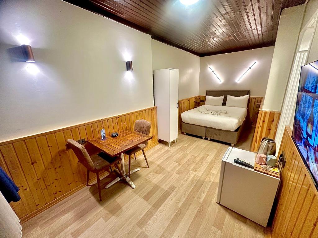 En eller flere senge i et værelse på Taksim Vista Apart