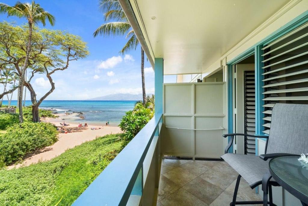 a balcony with a view of the beach at Napili Bay 210 · NB 210 Napili Bay Studio with Direct Ocean View in Kahana