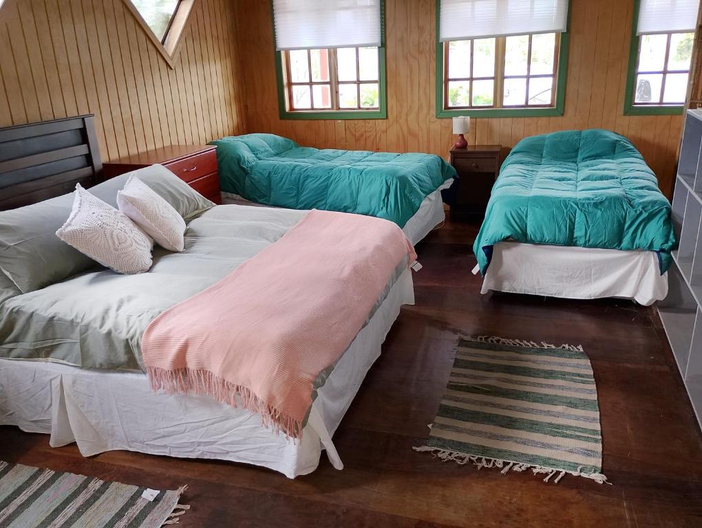 En eller flere senge i et værelse på El Refugio