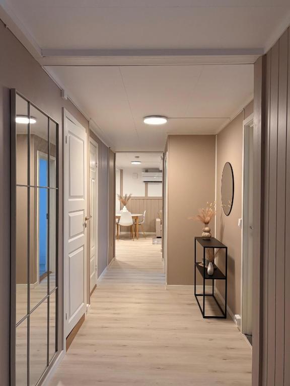 a corridor of an office building with a hallway at Kirkevegen apartment in Brumunddalen