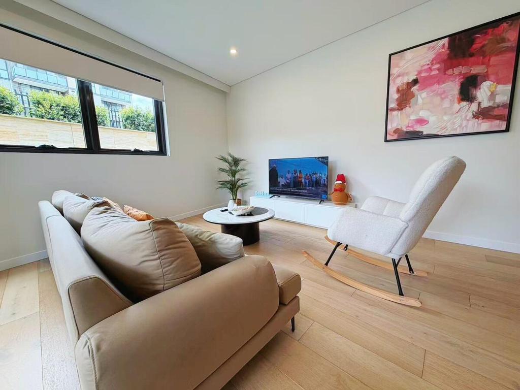 Χώρος καθιστικού στο Charming 1BR Escape in Epping Cozy & Central