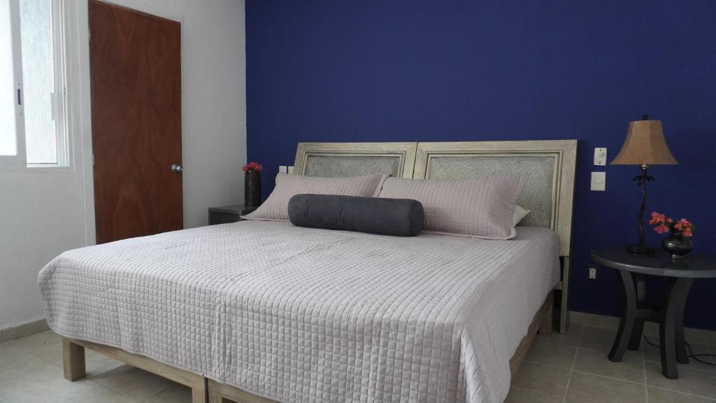 Ένα ή περισσότερα κρεβάτια σε δωμάτιο στο Condominio La Parota