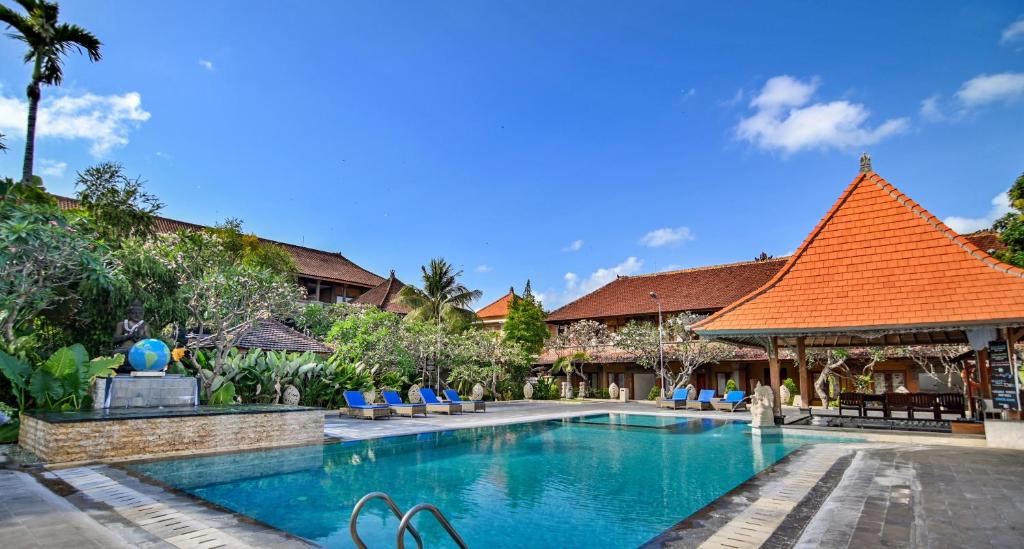 an image of a swimming pool at a resort at Satriya Cottages in Kuta