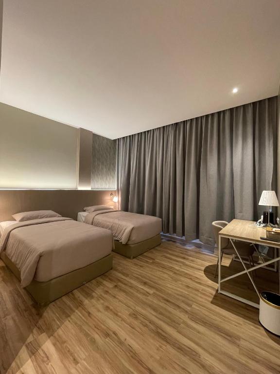 Ένα ή περισσότερα κρεβάτια σε δωμάτιο στο Innara Premium Guest House - Palangkaraya