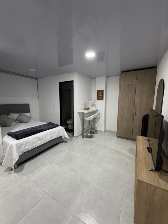 Ένα ή περισσότερα κρεβάτια σε δωμάτιο στο Loft en el corazón de Santa Rosa de Cabal