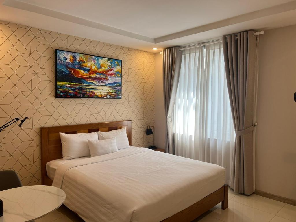 Ένα ή περισσότερα κρεβάτια σε δωμάτιο στο THE STAR HOTEL - PHU MY HUNG, HO CHI MINH - Korean Buffet Breakfast