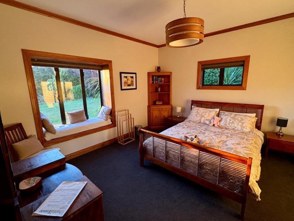 En eller flere senge i et værelse på Onetai Estate