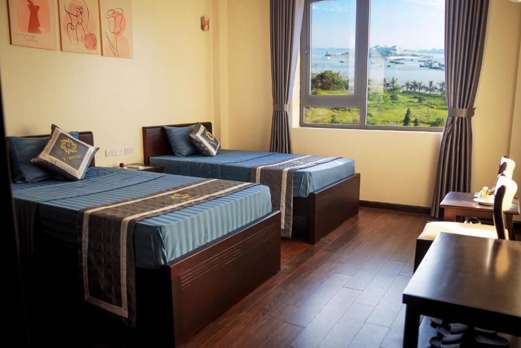 En eller flere senge i et værelse på Y - Hotel