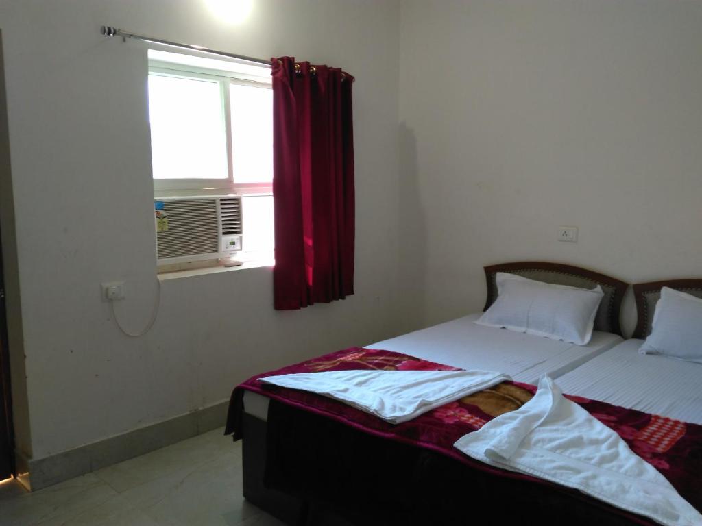 Postel nebo postele na pokoji v ubytování Rama Guest House