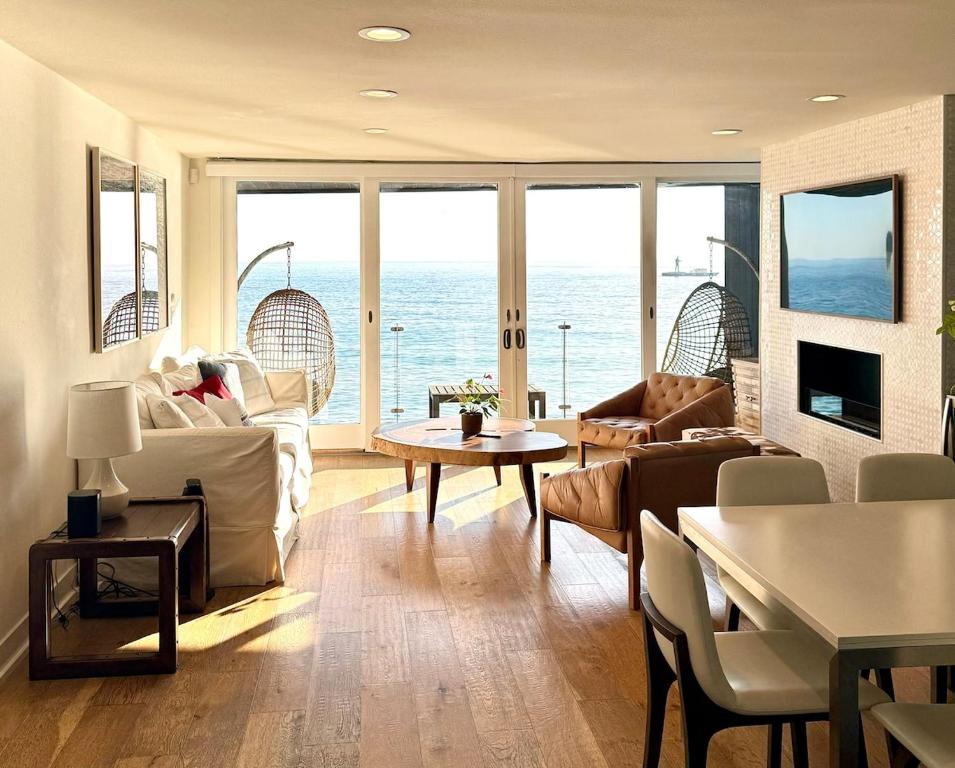 a living room with a view of the ocean at Malibu Waterfront Gallery with Private Beach Access in Malibu Beach