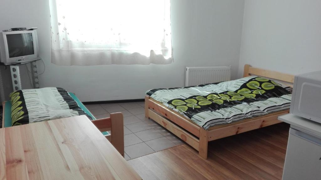 Postel nebo postele na pokoji v ubytování Pokoje Typu Studio Sosnowiec