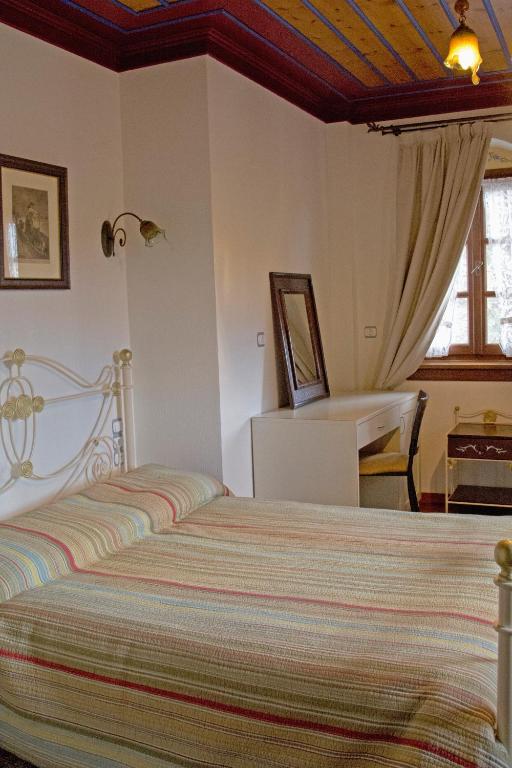Postel nebo postele na pokoji v ubytování Melinas Boutique Hotel B&B
