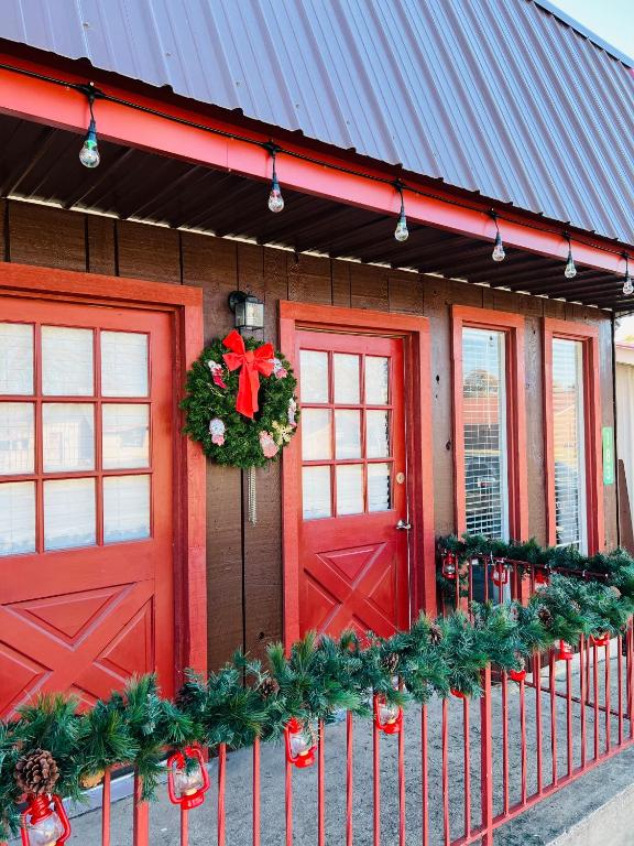 a building with a red door and a wreath on it at Lakeland House in Langley