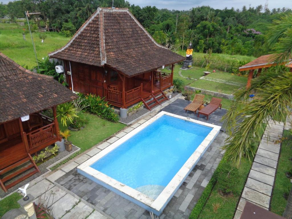 Πισίνα στο ή κοντά στο Griya Taman by Sundari Hospitality