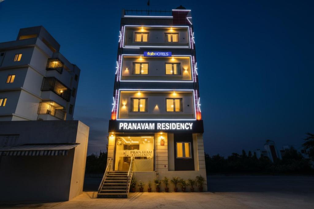 a tall building with akritkritkritkritkritkritkrithospital at FabHotel Pranavam Residency in Tirupati