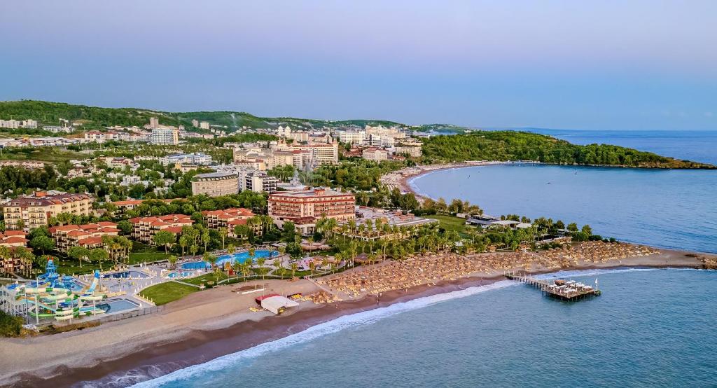 an aerial view of a resort on a beach at Justiniano Club Park Conti in Okurcalar