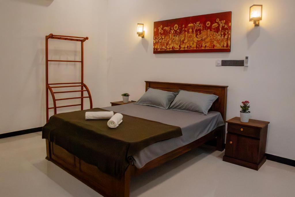 Ένα ή περισσότερα κρεβάτια σε δωμάτιο στο Mila Guest Bentota