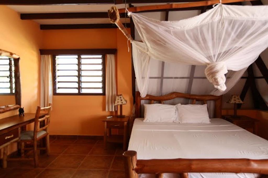 Postel nebo postele na pokoji v ubytování Sunset Villa Boutique Resort