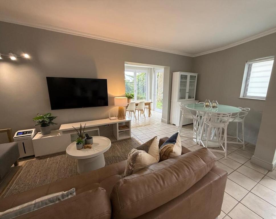a living room with a couch and a table at The Tidal Court in Sea Vista