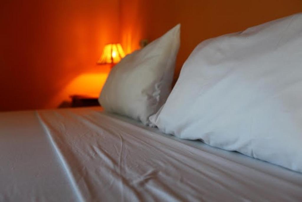 Postel nebo postele na pokoji v ubytování Sunset Villa Boutique Resort