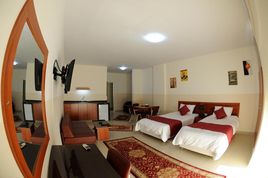 Postel nebo postele na pokoji v ubytování Byblos Guest House