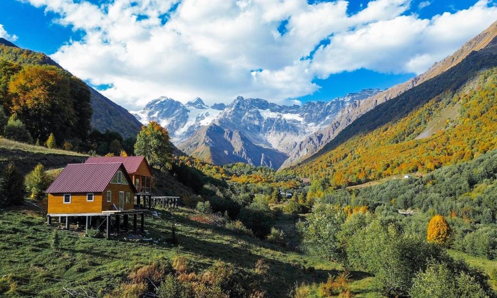a house in a valley with mountains in the background at SkyGona in Ghebi