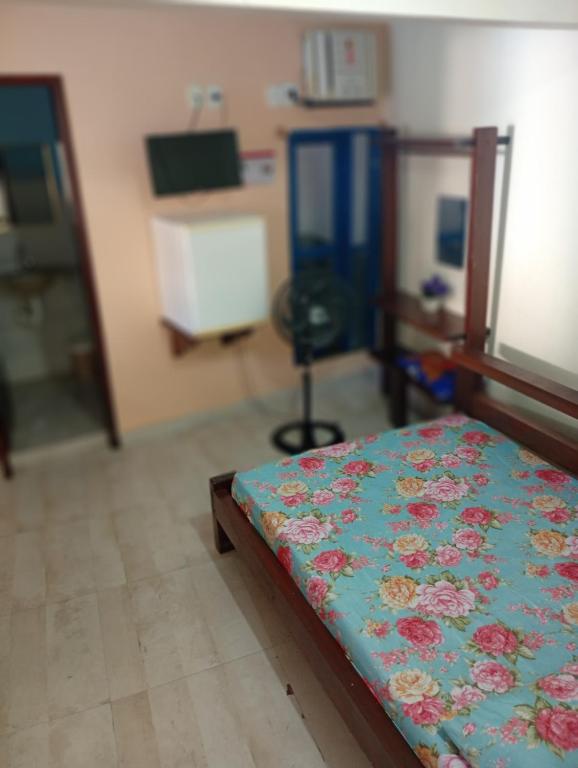 Ένα ή περισσότερα κρεβάτια σε δωμάτιο στο Pousada Descanse & Curta