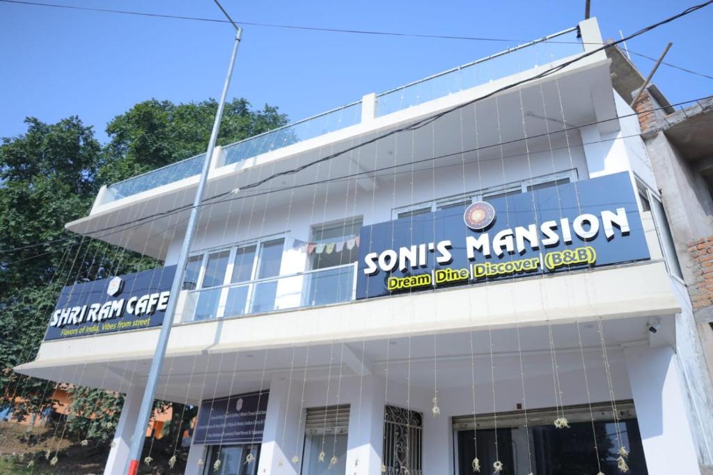 a building with a sign for a sons mission at Soni's Mansion-100m from Khajuraho Temples in Khajurāho