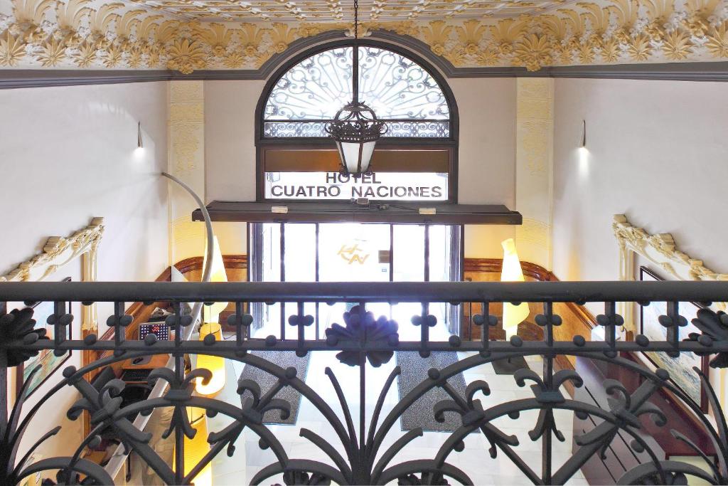 a sign for a gucci store in a building at Cuatro Naciones in Barcelona