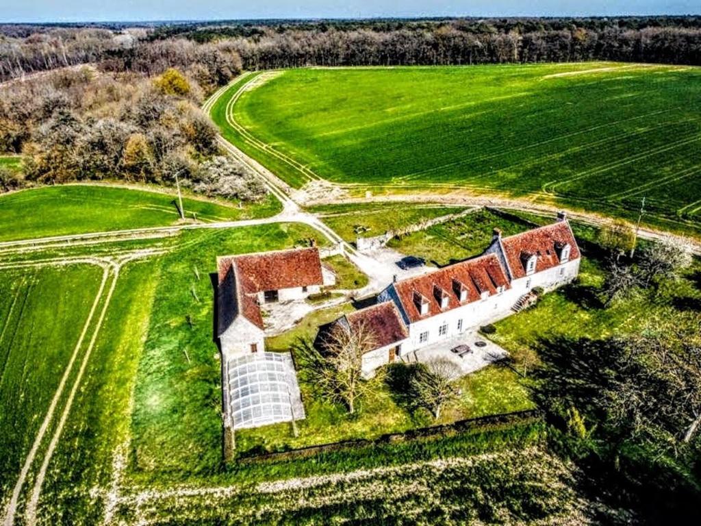 an aerial view of a house in a field at Gîte Gué Léger - Nature & Spa - Jacuzzi, Sauna - Piscine chauffée toute l'année - 15 pers in Chanceaux-près-Loches