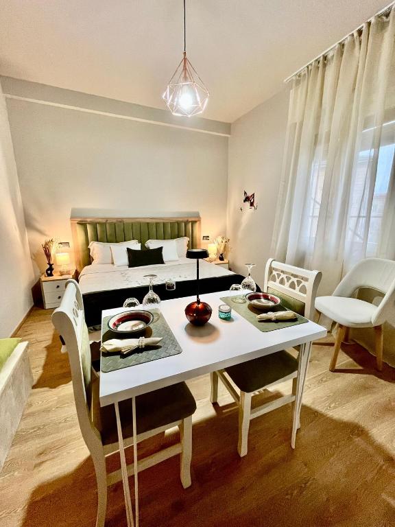 a bedroom with a bed and a table and chairs at Angy's House in Verona