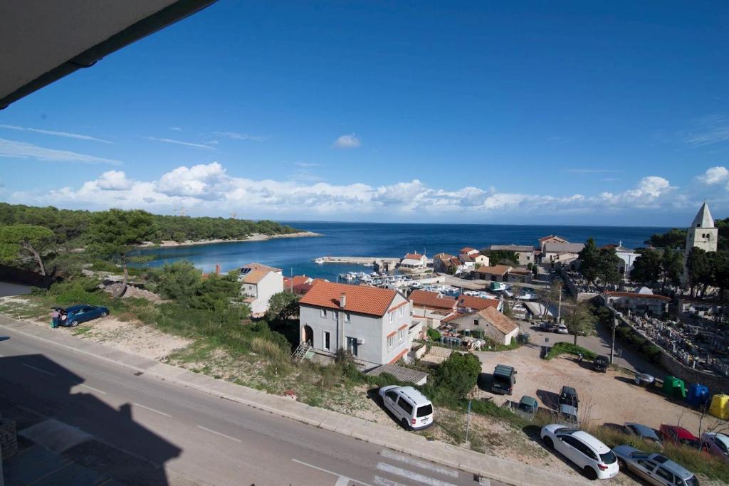 a view of a town with a river and a city at B&B sv. Martin in Mali Lošinj