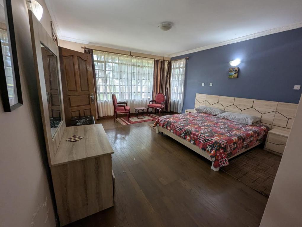 Ένα ή περισσότερα κρεβάτια σε δωμάτιο στο Runda Paradise by Pendo