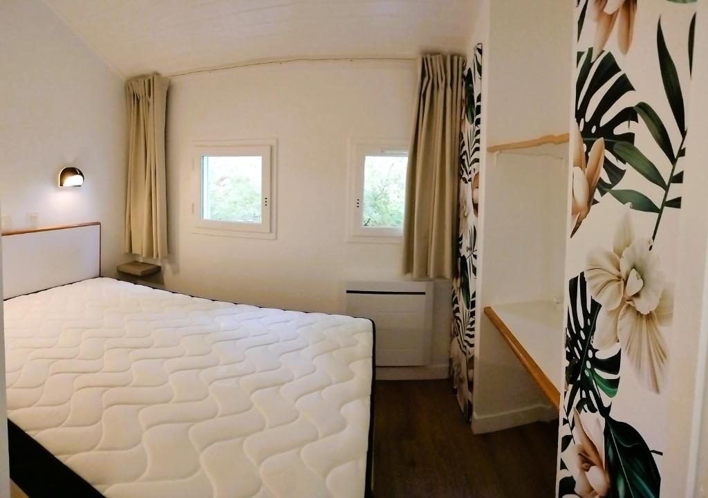 En eller flere senge i et værelse på La bulle de Lily