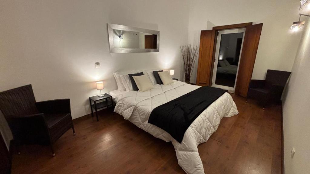 Ένα ή περισσότερα κρεβάτια σε δωμάτιο στο Pouso Du'Vagar