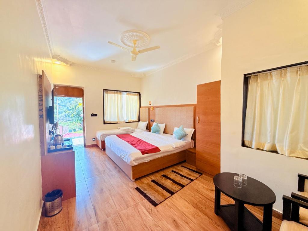 Ένα ή περισσότερα κρεβάτια σε δωμάτιο στο Green Valley Resort