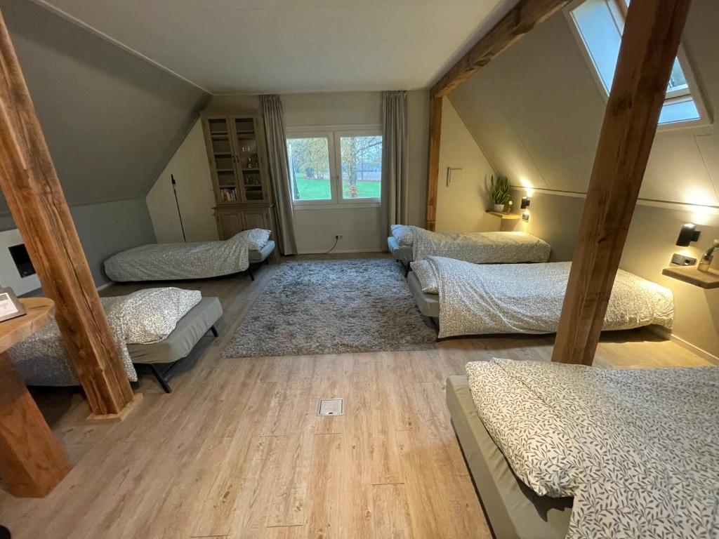 Ένα ή περισσότερα κρεβάτια σε δωμάτιο στο Landgoed Bekspring