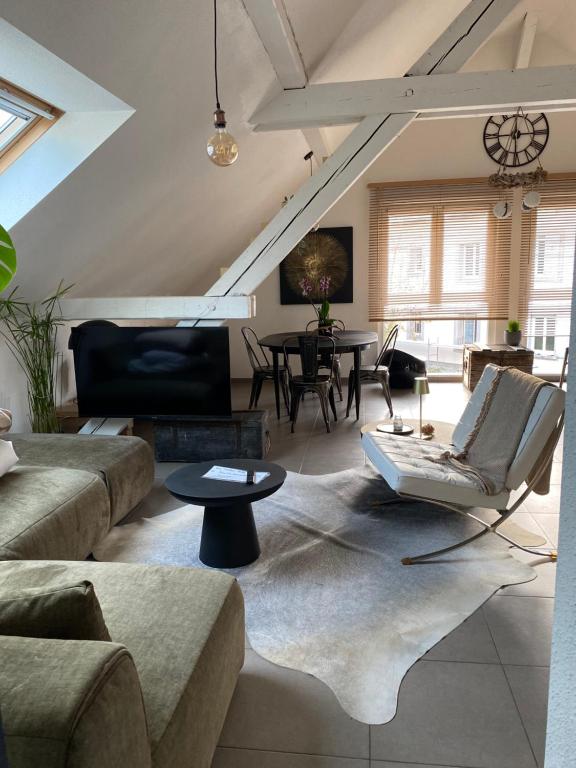 Posezení v ubytování Appartement atypique lumineux