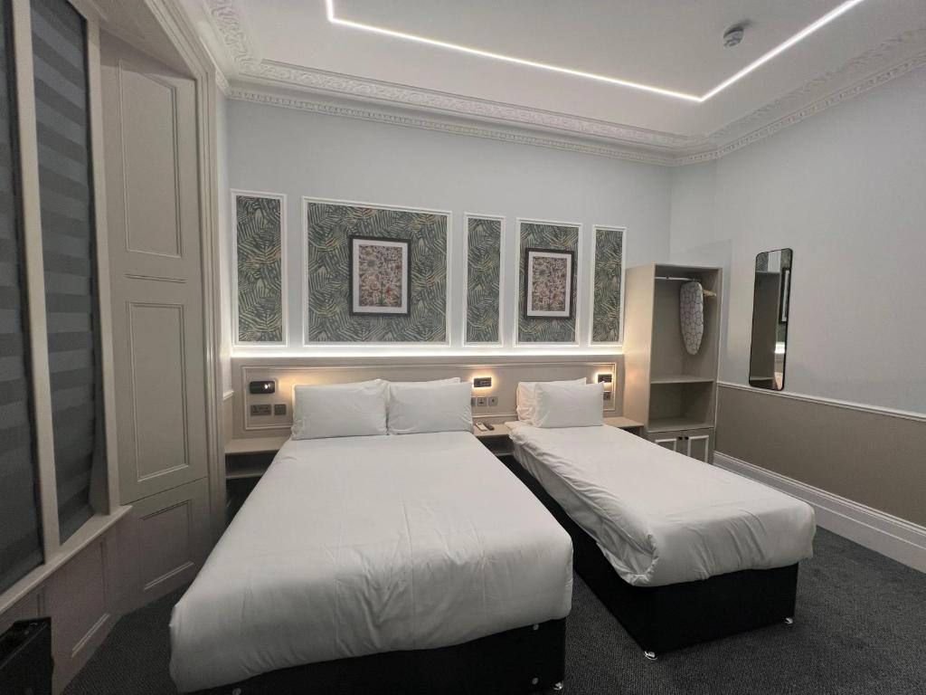 Кровать или кровати в номере MSK The Whiteley