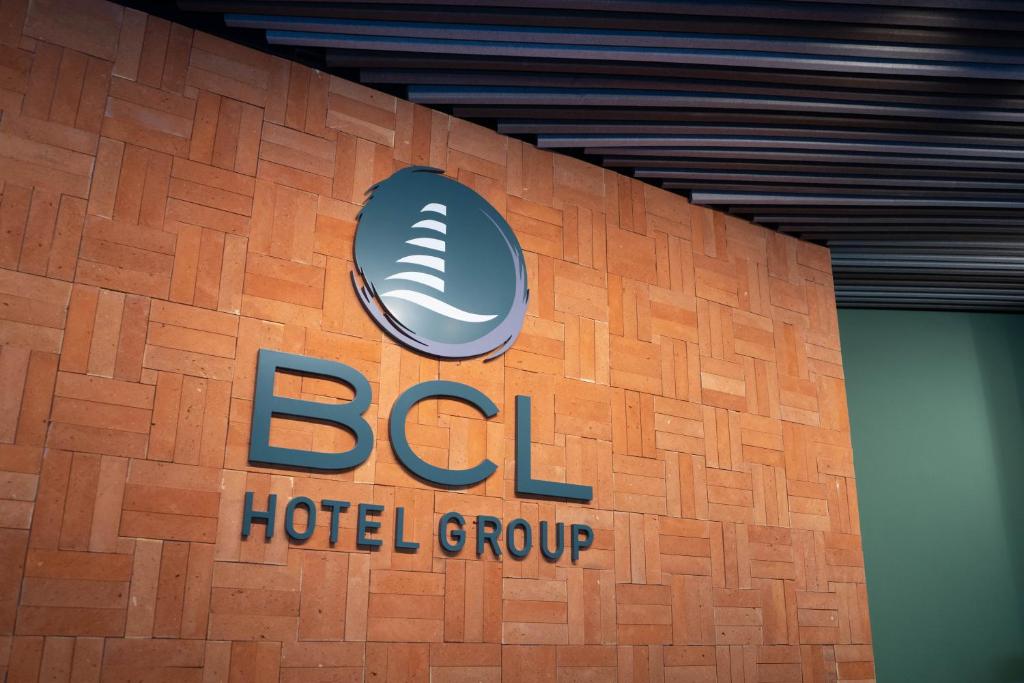 a hotel group sign on the side of a building at Hotel BCL Podium La Nucia in La Nucía