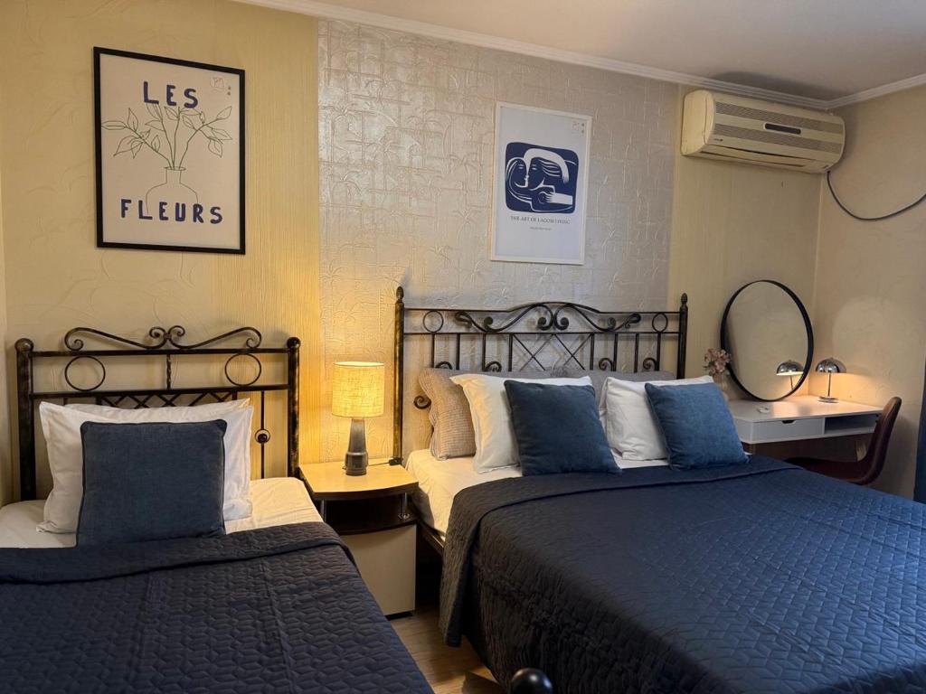 Giường trong phòng chung tại Home Boutique Hotel