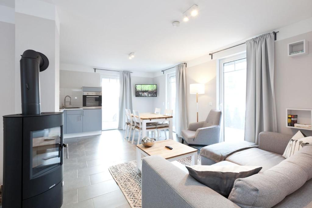 Телевизор и/или развлекательный центр в Apartment unter den Kiefern