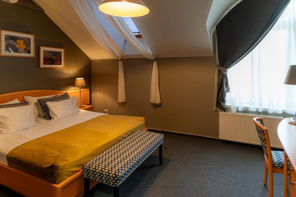 Postel nebo postele na pokoji v ubytování Hotel Piano