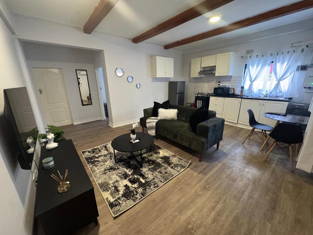 a living room with a couch and a table at The Vantage in Lusaka